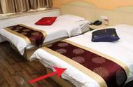 宾馆床上铺的一条布有啥用（酒店床上铺一条布是干啥用的）